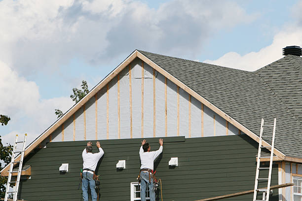 Professional Siding Repair technician working in Island Park, NY